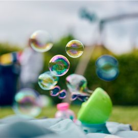 a-playful-moment-with-soap-bubbles-floating-over-a